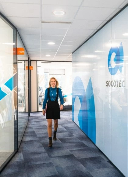 visual of a socotec expert walking at the headquarters